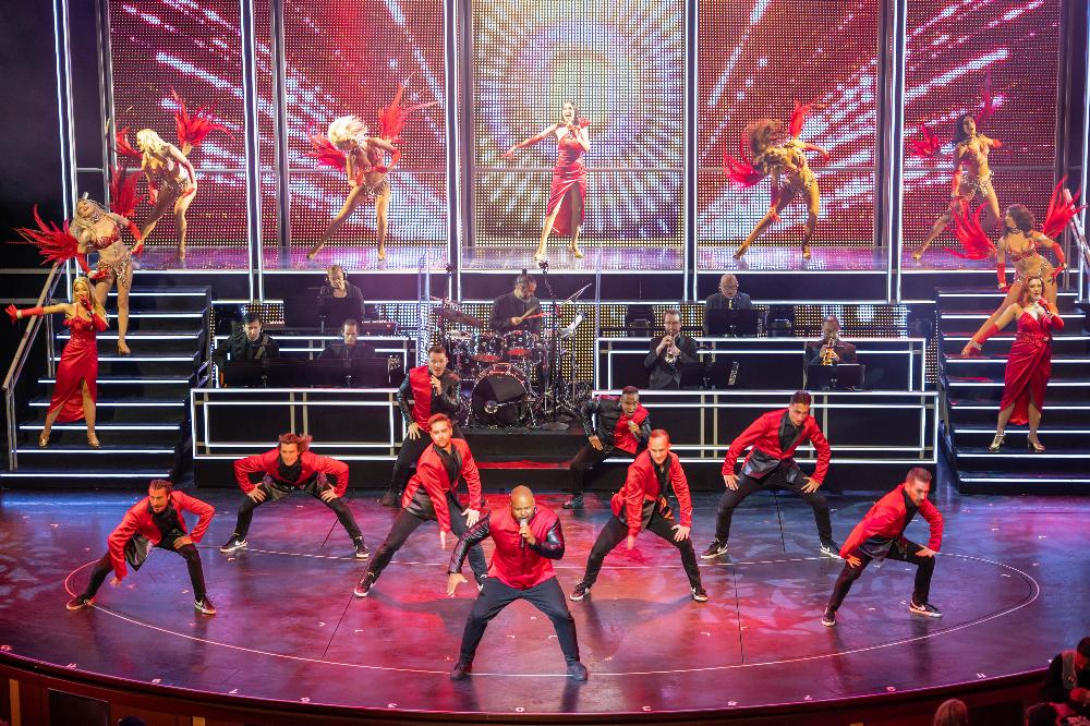 Original entertainment on board Ovation of the Seas takes center stage with high-energy performances in the Royal Theater, like "Live.