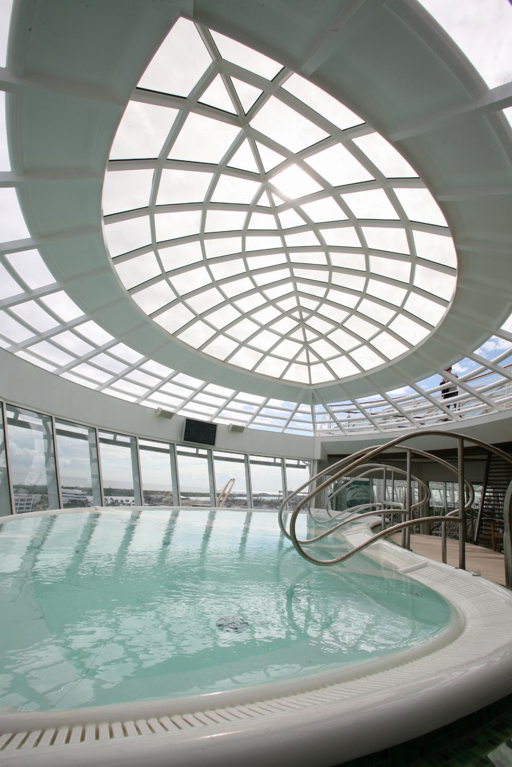 A cantilevered whirlpool onboard Oasis of the Seas , the world's largest and most revolutionary cruise ship.