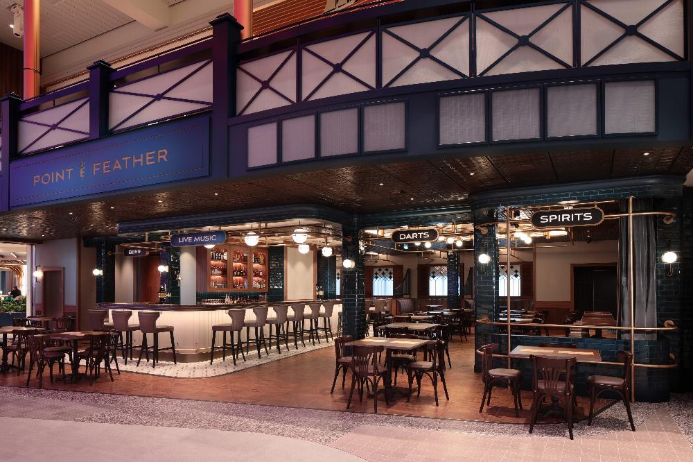 Icon of the Seas' Point & Feather, the neighborhood English pub on Royal Promenade, has a new open layout, games - and tournaments - of darts and sips joining the signature…